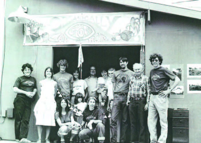 Figure 1. This photo is from the grand opening of OGC in 1983. Standing from left to right are Tom Forster, Kellee Adams, Keith Walton, Ellen Walton, Jack Gray, Mary Jo Wade who’s holding her and Jack’s son Sam, Willard Berg, Joe Gabriel, George Perry and